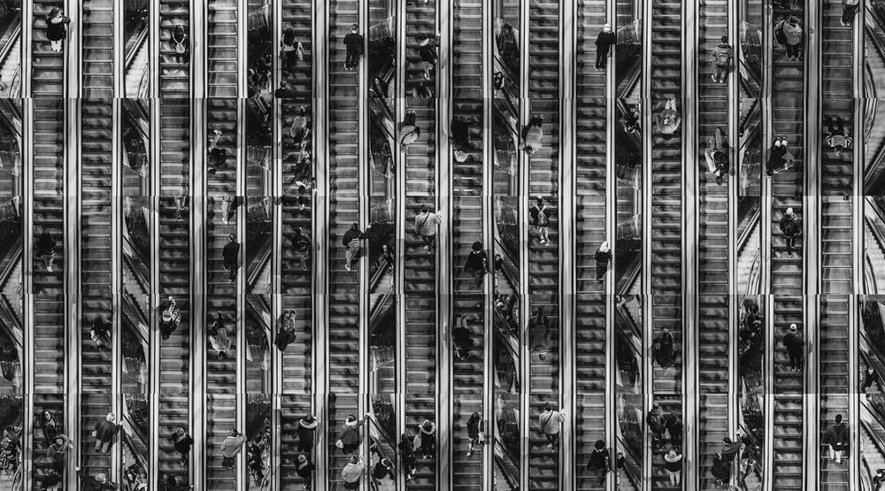 Documentary photography by Irene Pietrella from the 'Next Stop' project, capturing the geometric patterns and light in a subway stairwell