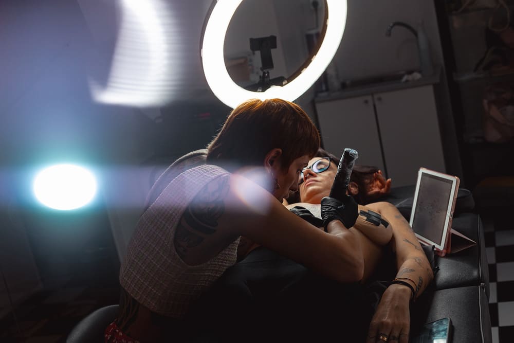 Studio portrait by Irene Pietrella focusing on detailed skin art and individual expression, professional photography